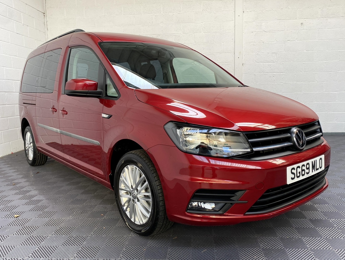 Wheelchair Adapted Volkswagen Caddy Maxi in Metallic Red with only 2000 miles from new. This vehicle is for sale at Michael Harraway cars in Weston super Mare. somerset. SG69 MLO 18