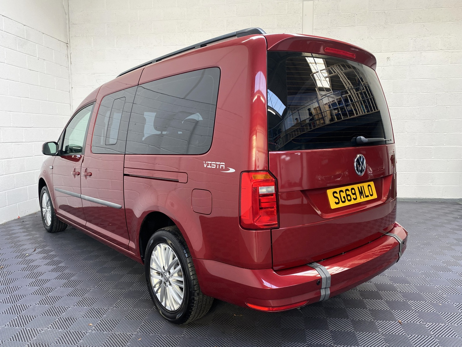 Wheelchair Adapted Volkswagen Caddy Maxi in Metallic Red with only 2000 miles from new. This vehicle is for sale at Michael Harraway cars in Weston super Mare. somerset. SG69 MLO 2