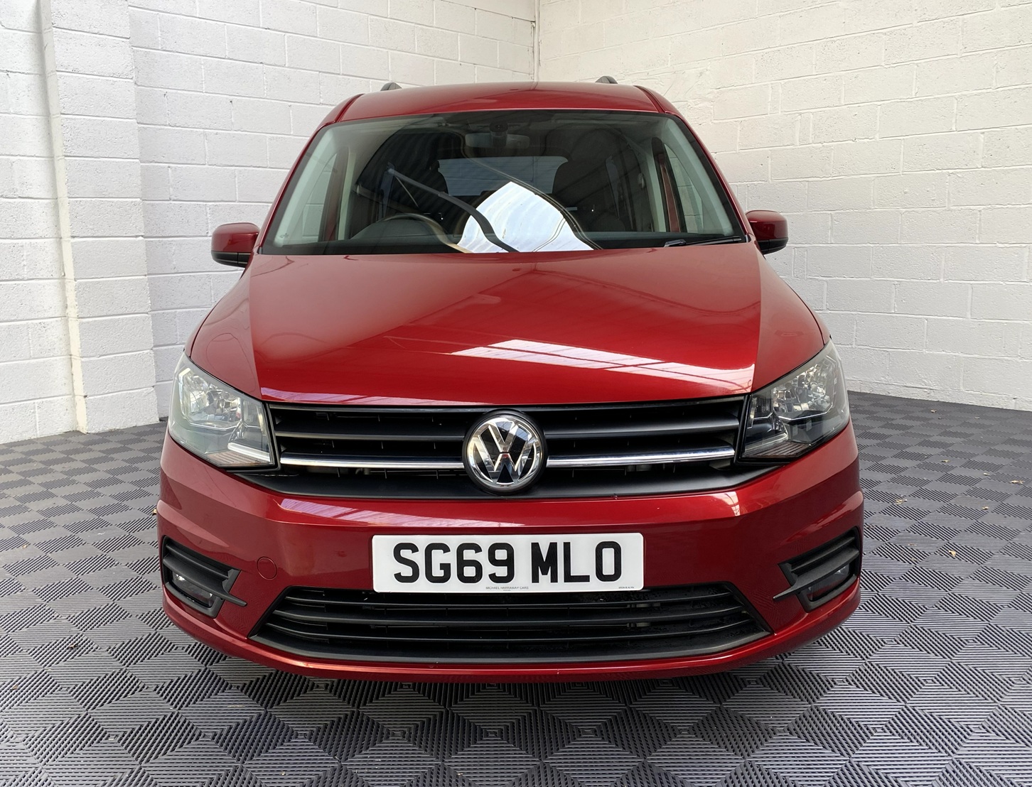 Wheelchair Adapted Volkswagen Caddy Maxi in Metallic Red with only 2000 miles from new. This vehicle is for sale at Michael Harraway cars in Weston super Mare. somerset. SG69 MLO 20