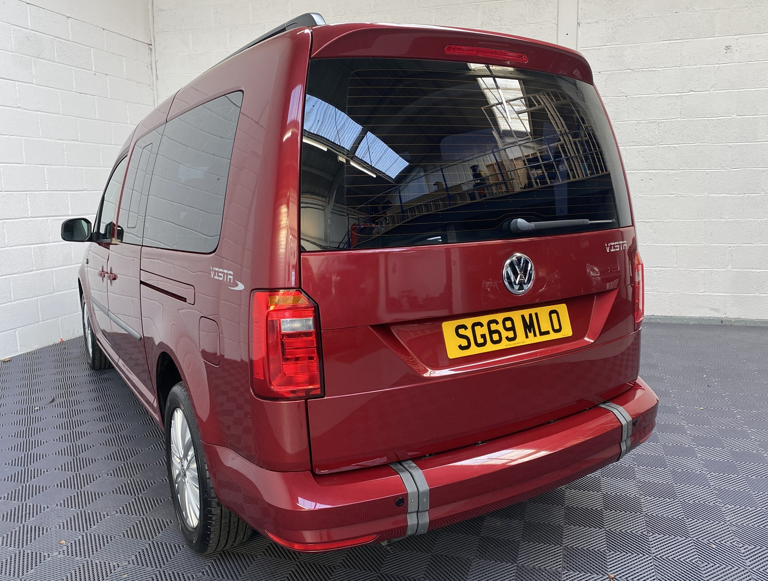 Wheelchair Adapted Volkswagen Caddy Maxi in Metallic Red with only 2000 miles from new. This vehicle is for sale at Michael Harraway cars in Weston super Mare. somerset. SG69 MLO 3