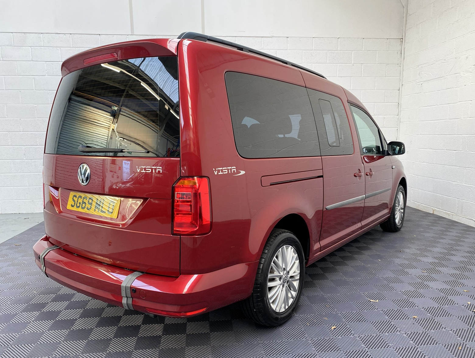 Wheelchair Adapted Volkswagen Caddy Maxi in Metallic Red with only 2000 miles from new. This vehicle is for sale at Michael Harraway cars in Weston super Mare. somerset. SG69 MLO 4