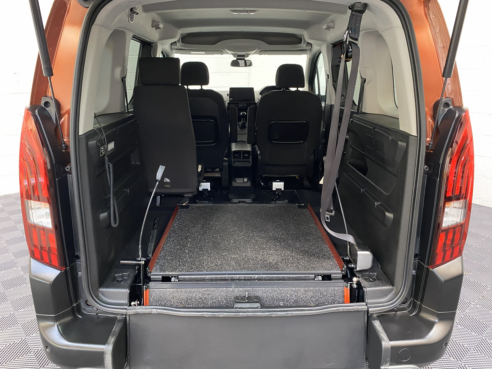 A Peugeot Rifter with Disabled Accessible. Finish in Bronze. Displayed for sale at Michael Harraway Cars who are located in Weston super Mare. SB21 JXV 10