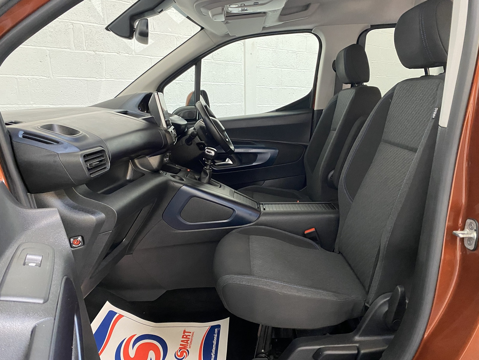 A Peugeot Rifter with Disabled Accessible. Finish in Bronze. Displayed for sale at Michael Harraway Cars who are located in Weston super Mare. SB21 JXV 14