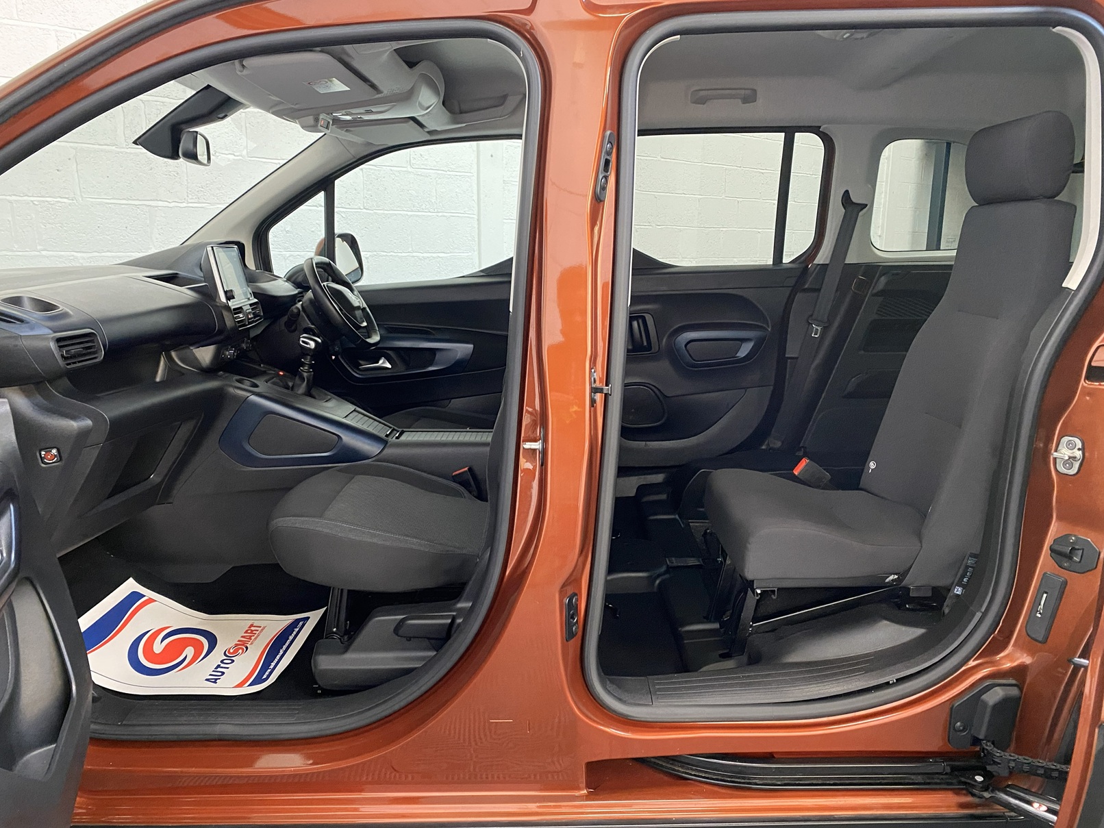 A Peugeot Rifter with Disabled Accessible. Finish in Bronze. Displayed for sale at Michael Harraway Cars who are located in Weston super Mare. SB21 JXV 17