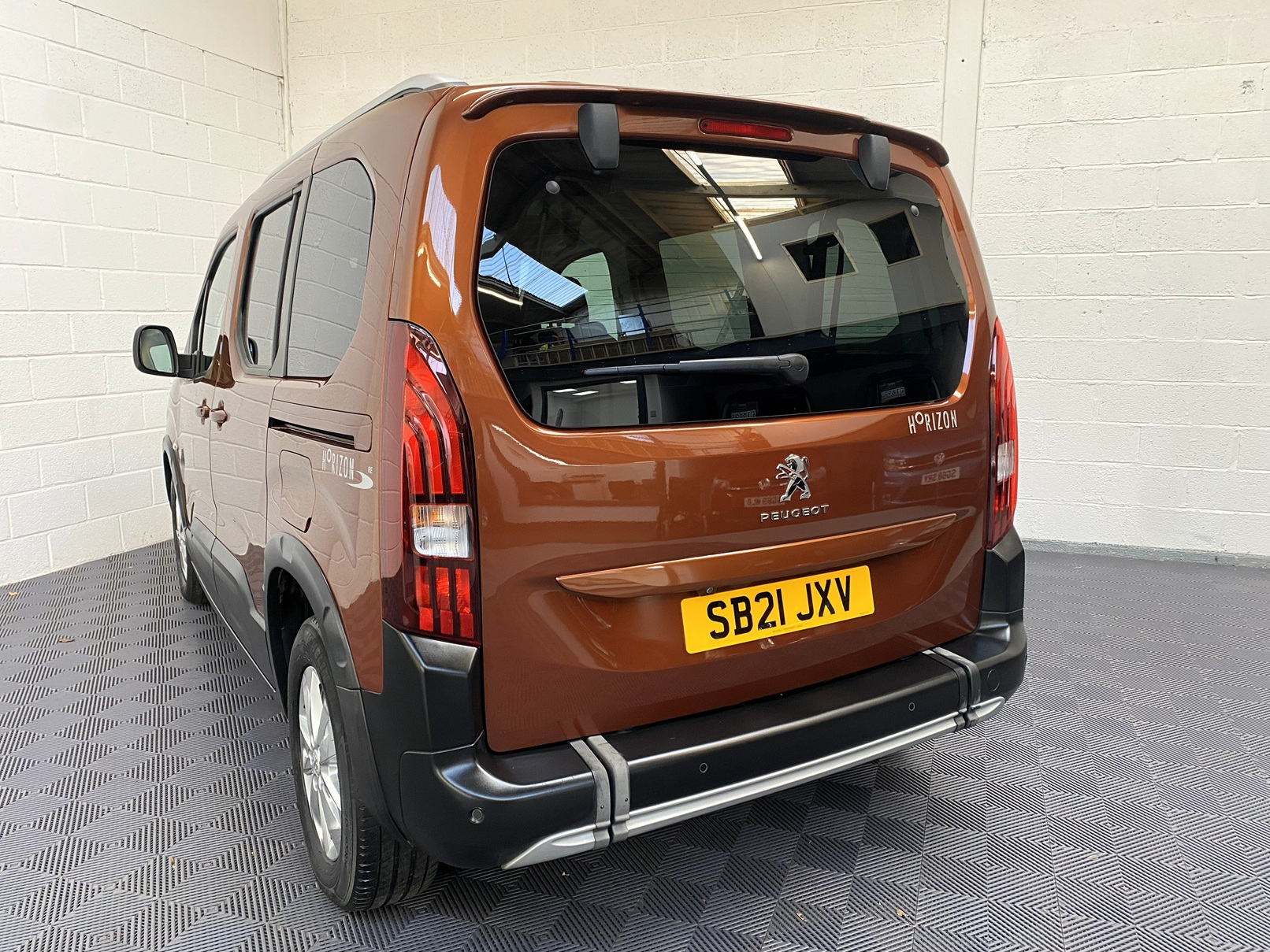 A Peugeot Rifter with Disabled Accessible. Finish in Bronze. Displayed for sale at Michael Harraway Cars who are located in Weston super Mare. SB21 JXV 2