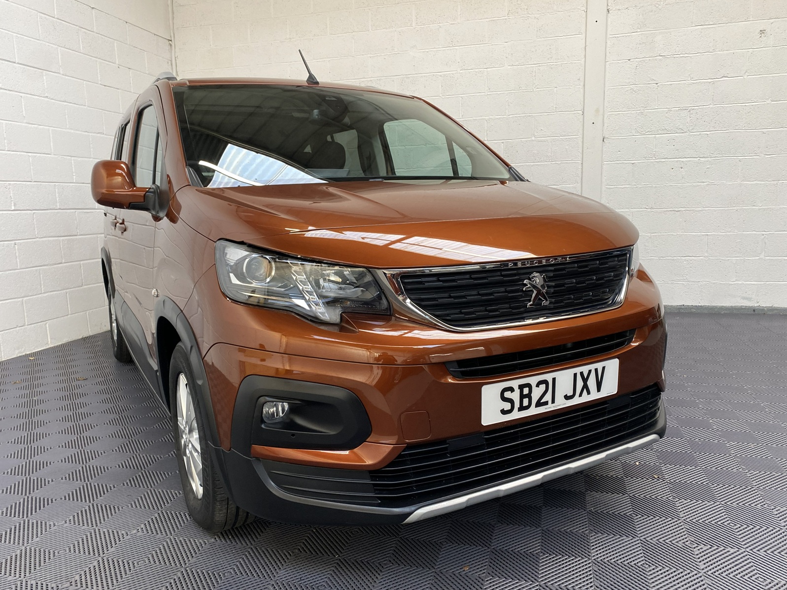 A Peugeot Rifter with Disabled Accessible. Finish in Bronze. Displayed for sale at Michael Harraway Cars who are located in Weston super Mare. SB21 JXV 21