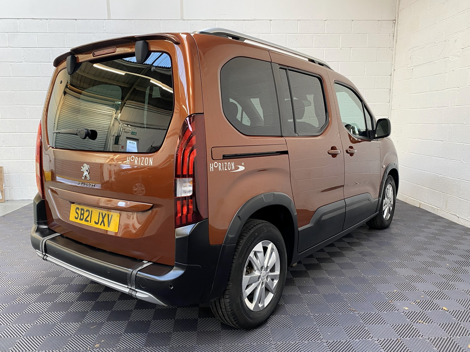 A Peugeot Rifter with Disabled Accessible. Finish in Bronze. Displayed for sale at Michael Harraway Cars who are located in Weston super Mare. SB21 JXV 4
