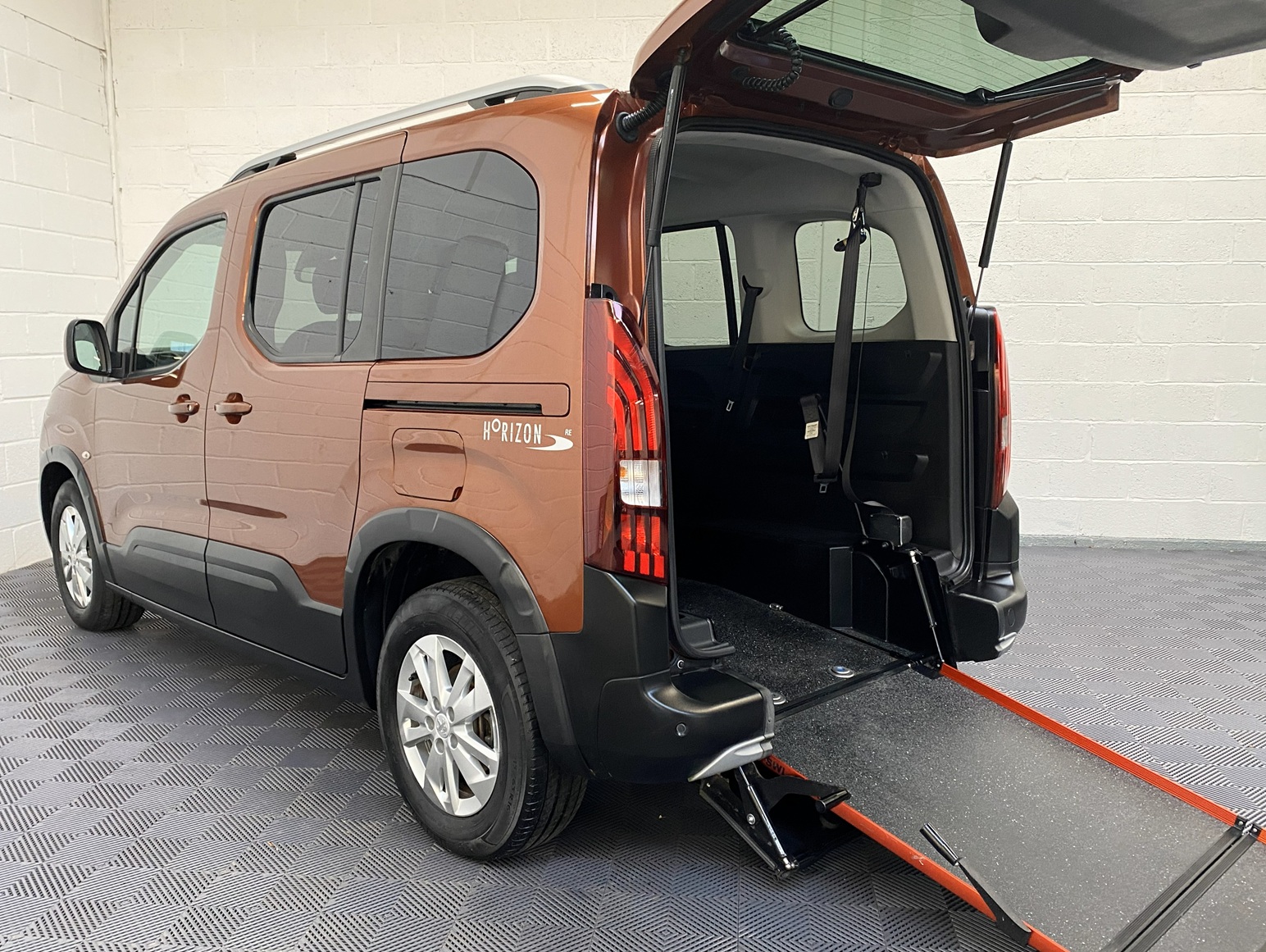 A Peugeot Rifter with Disabled Accessible. Finish in Bronze. Displayed for sale at Michael Harraway Cars who are located in Weston super Mare. SB21 JXV 9