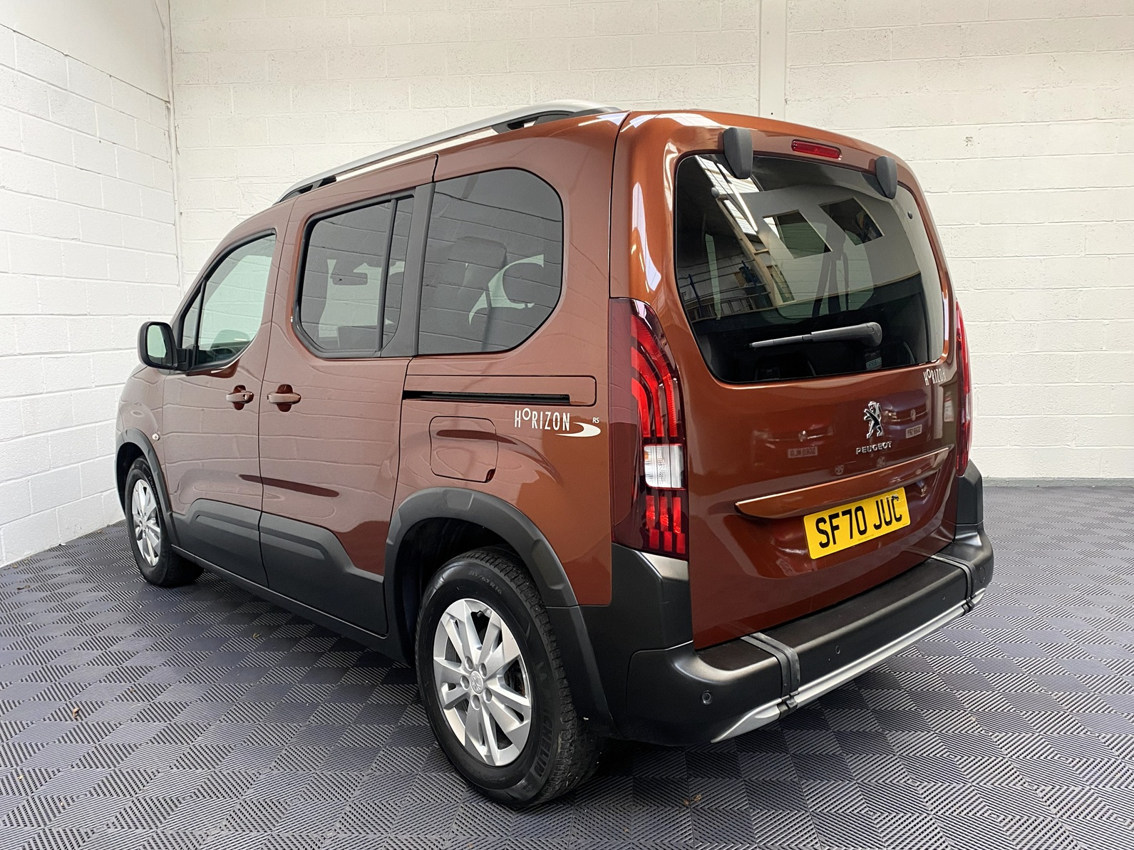 Disabled Accessible Peugeot Rifter in Bronze. It has 5 seats or 3 seats plus wheelchair passenger. This vehicle is for sale at Michael Harraway Cars in Weston super Mare. SF70 JUC 1