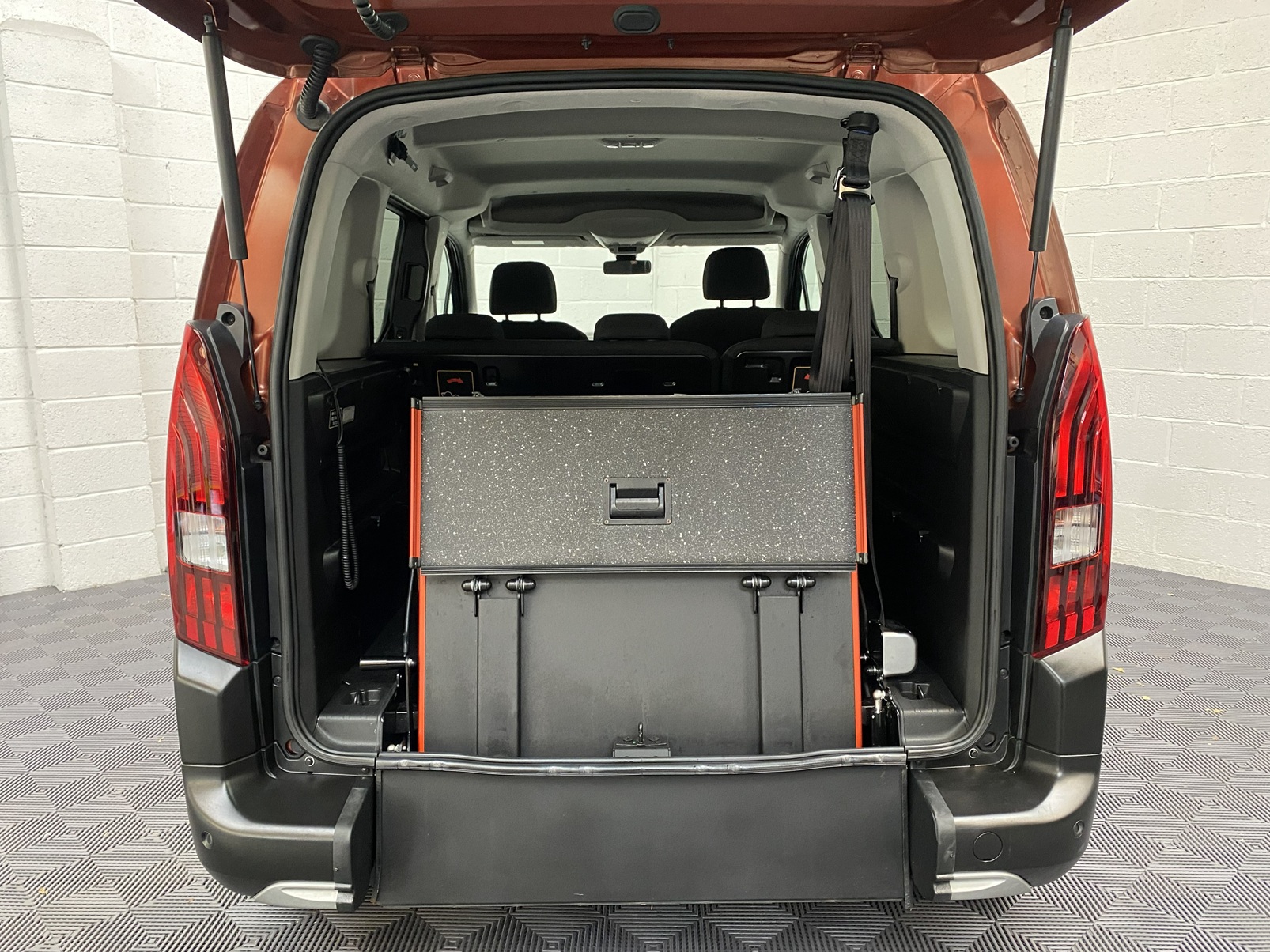 Disabled Accessible Peugeot Rifter in Bronze. It has 5 seats or 3 seats plus wheelchair passenger. This vehicle is for sale at Michael Harraway Cars in Weston super Mare. SF70 JUC 12