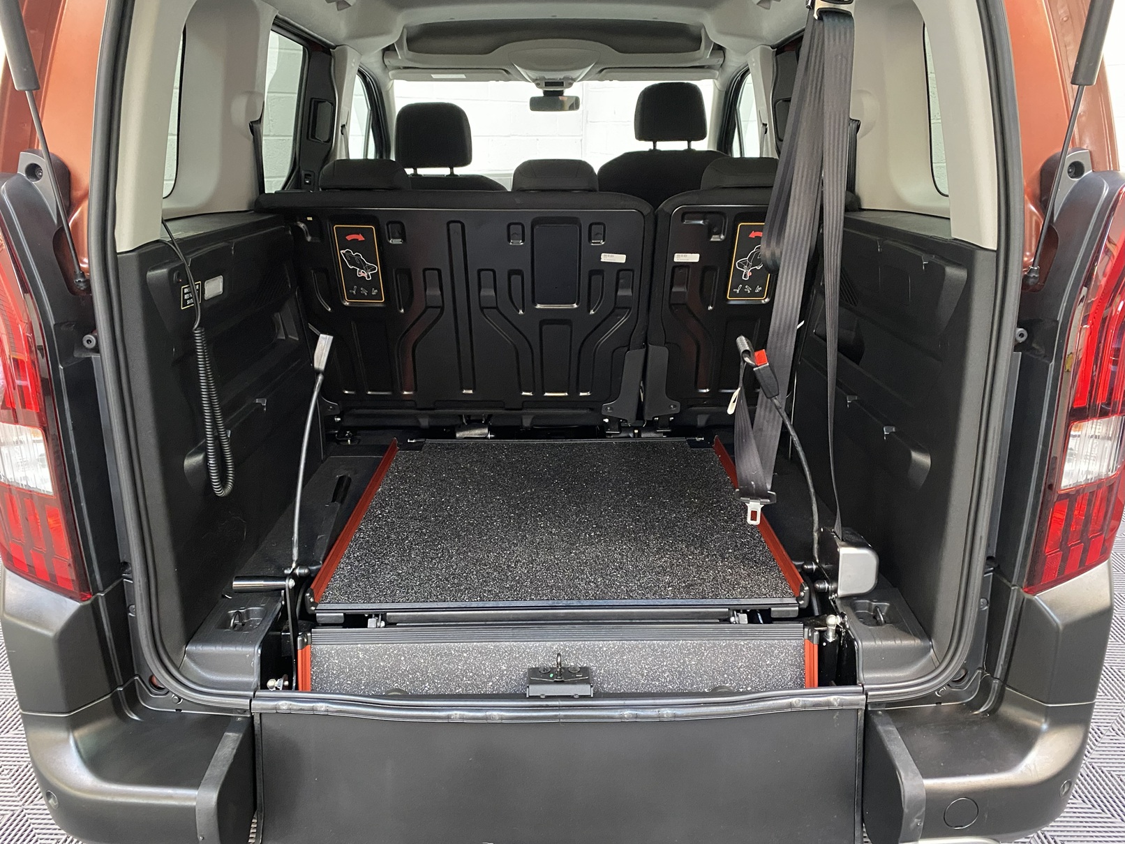 Disabled Accessible Peugeot Rifter in Bronze. It has 5 seats or 3 seats plus wheelchair passenger. This vehicle is for sale at Michael Harraway Cars in Weston super Mare. SF70 JUC 5