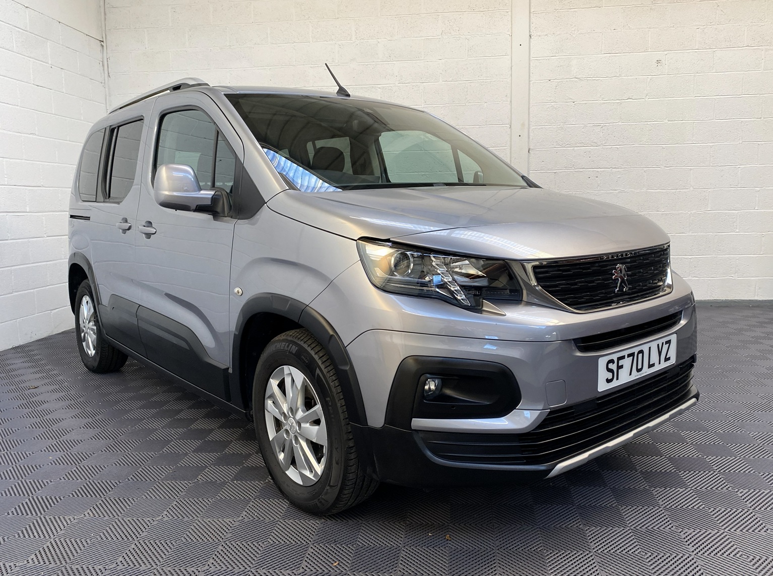 A Peugeot Rifter with Disabled Accessible. Finish in Bronze. Displayed for sale at Michael Harraway Cars who are located in Weston super Mare. SF70 LYZ 16