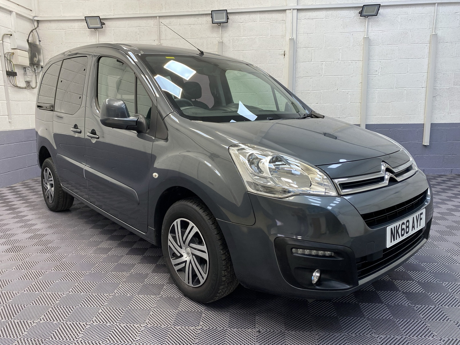 A Grey wheelchair accessible accessible (WAV) Citroen Berlingo that is for sale at Michael Harraway Cars Front view. NK68 AYF 1