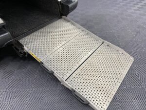Automotive converted Citroen Berlingo rear wheelchair ramp folded out.