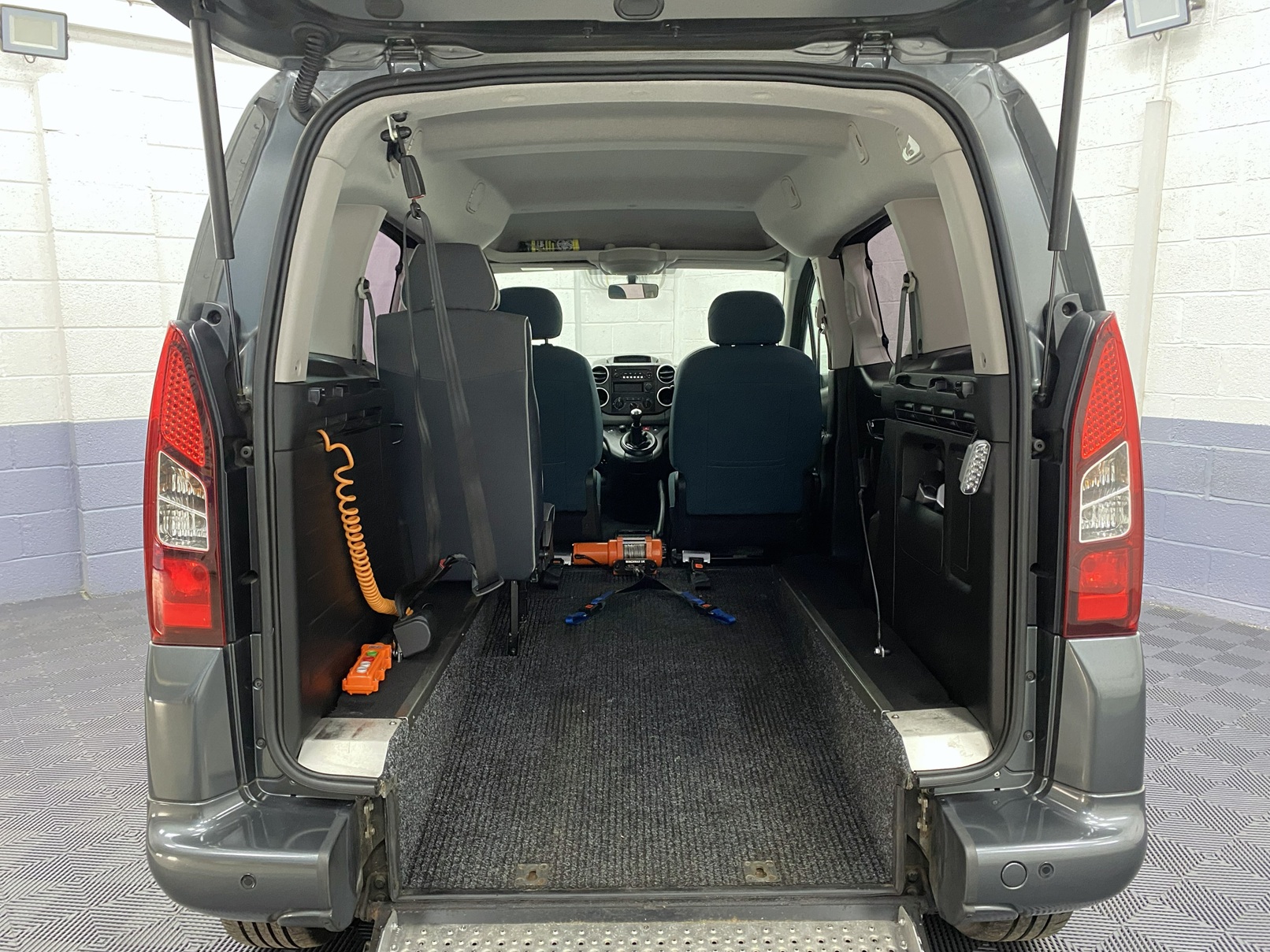 rear Interior view showing lowered rear floor section of a wheelchair accessible accessible (WAV) Citroen Berlingo that is for sale at Michael Harraway Cars in Weston super Mare NK68 AYF 11