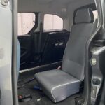 The rear single seat of a wheelchair accessible Citroen Berlingo Nk68 AYF 17