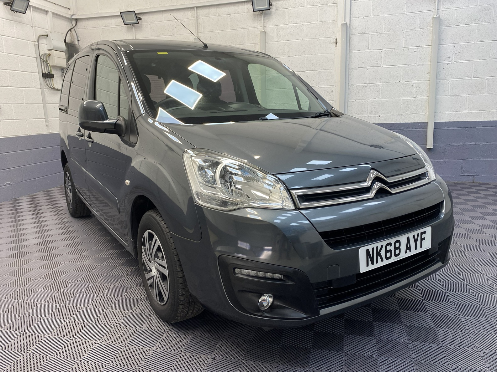 A Grey wheelchair accessible accessible (WAV) Citroen Berlingo that is for sale at Michael Harraway Cars Front view. NK68 AYF 2