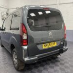 A Grey wheelchair accessible accessible (WAV) Citroen Berlingo that is for sale at Michael Harraway Cars in Weston super Mare Rear side view. NK68 AYF 6