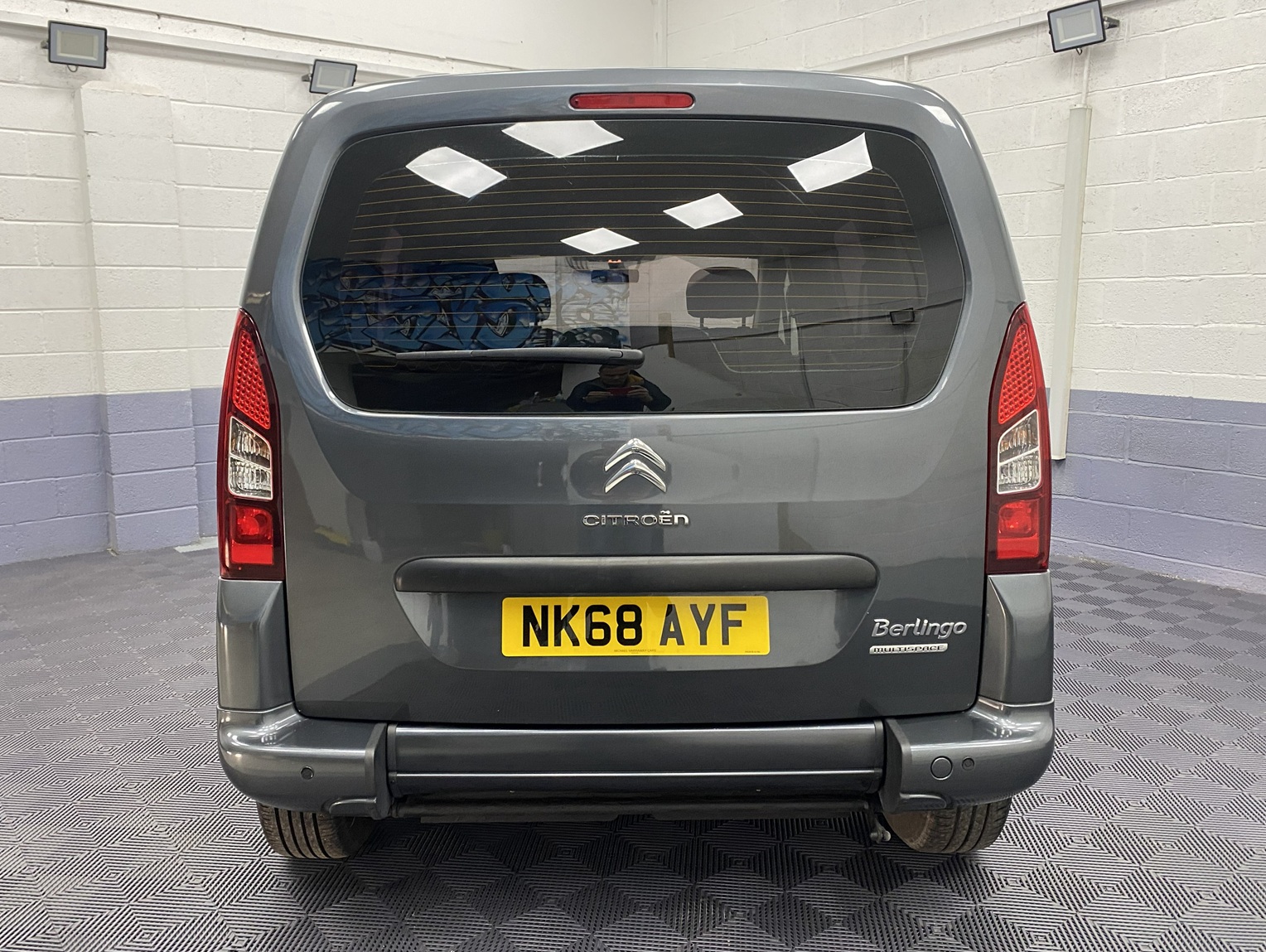 A Grey wheelchair accessible accessible (WAV) Citroen Berlingo that is for sale at Michael Harraway Cars in Weston super Mare Rear view. NK68 AYF 6