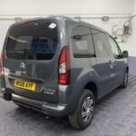 A Grey wheelchair accessible accessible (WAV) Citroen Berlingo that is for sale at Michael Harraway Cars in Weston super Mare Rear side view. NK68 AYF 8