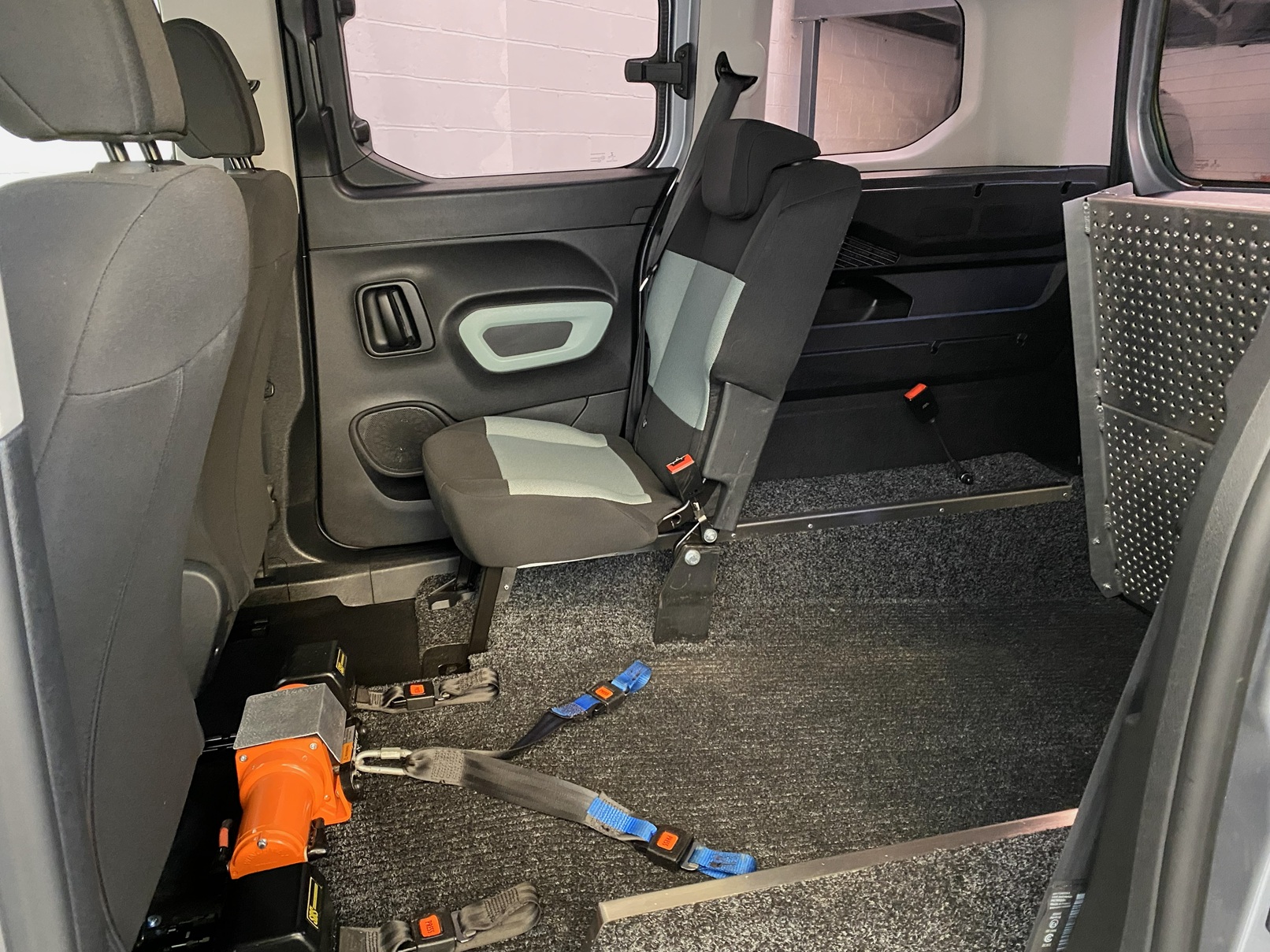 Citroen Berlingo WAV wheelchair accessible vehicle for sale at Michael Harraway Cars, Weston-super-Mare, with three passenger seats, space for one wheelchair user, and a lightweight rear access ramp. NK70 AUA 13