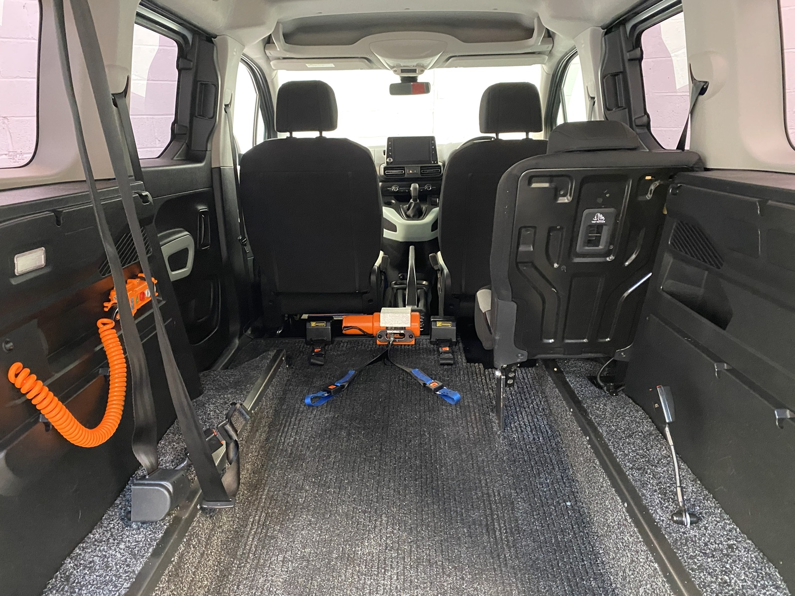 Citroen Berlingo WAV wheelchair accessible vehicle for sale at Michael Harraway Cars, Weston-super-Mare, with three passenger seats, space for one wheelchair user, and a lightweight rear access ramp. NK70 AUA 14
