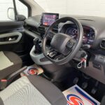 Citroen Berlingo WAV wheelchair accessible vehicle for sale at Michael Harraway Cars, Weston-super-Mare, with three passenger seats, space for one wheelchair user, and a lightweight rear access ramp. NK70 AUA 15