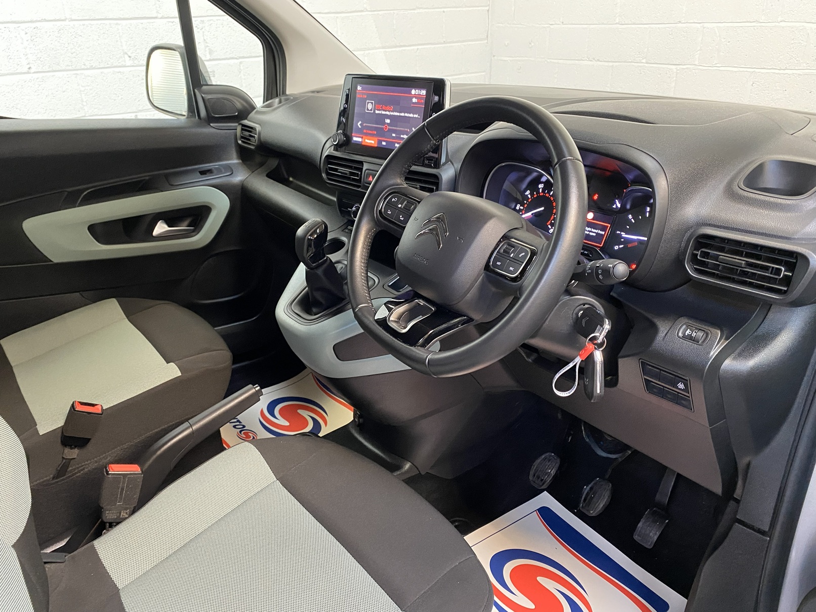 Citroen Berlingo WAV wheelchair accessible vehicle for sale at Michael Harraway Cars, Weston-super-Mare, with three passenger seats, space for one wheelchair user, and a lightweight rear access ramp. NK70 AUA 15