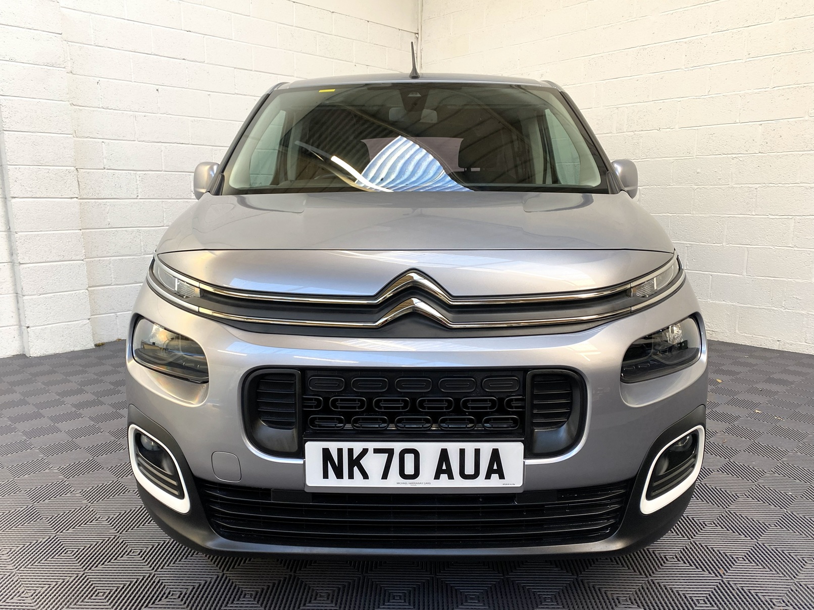 Citroen Berlingo WAV wheelchair accessible vehicle for sale at Michael Harraway Cars, Weston-super-Mare, with three passenger seats, space for one wheelchair user, and a lightweight rear access ramp. NK70 AUA 18