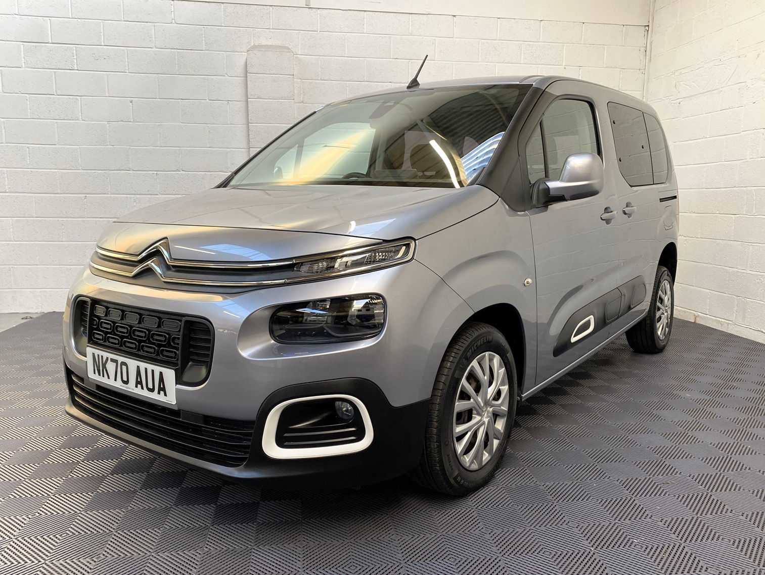Citroen Berlingo WAV wheelchair accessible vehicle for sale at Michael Harraway Cars, Weston-super-Mare, with three passenger seats, space for one wheelchair user, and a lightweight rear access ramp. NK70 AUA 19
