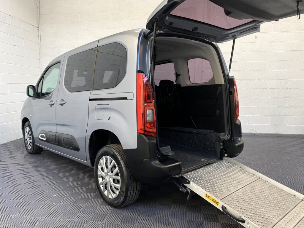 “Silver Citroën Berlingo Wheelchair Accessible Vehicle with rear ramp deployed, shown from rear three-quarter view, for sale at Michael Harraway Cars, Weston-super-Mare, North Somerset.” NK70 AUA 1