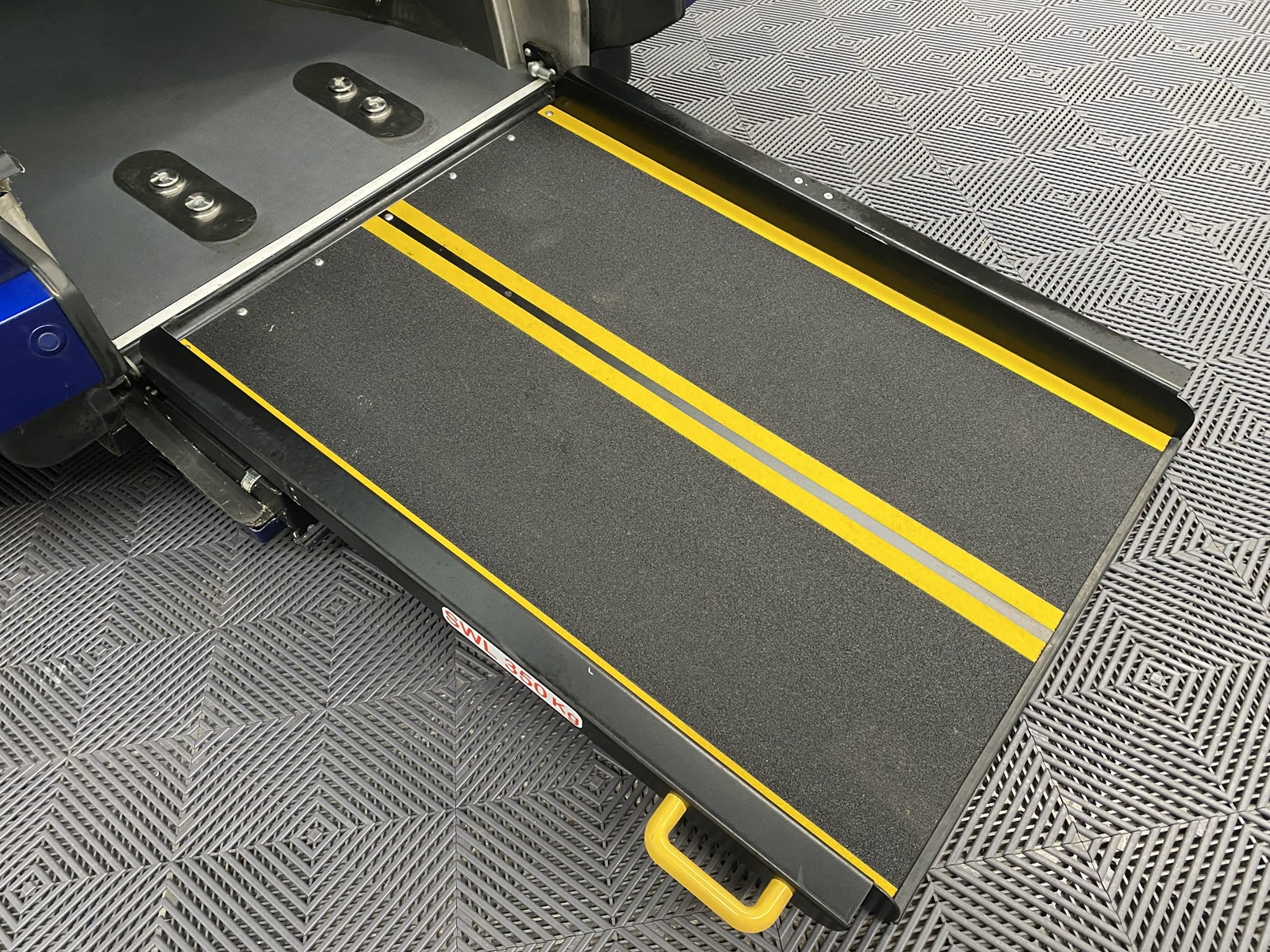 The Rear Ramp diploid on a Wheelchair Accessible Vehicle Ford Tourneo Connect Titanium. Finish in Metallic Blue. For Sae at Michael Harraway Cars in Weston super Mare HG68 MMO 4