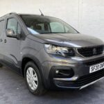 Peugeot Rifter WAV wheelchair accessible vehicle for sale at Michael Harraway Cars, Weston-super-Mare, with three passenger seats, space for one wheelchair user, and a lightweight fold-flat rear access ramp. SF20 GNP 1