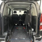 Peugeot Rifter WAV wheelchair accessible vehicle for sale at Michael Harraway Cars, Weston-super-Mare, with three passenger seats, space for one wheelchair user, and a lightweight fold-flat rear access ramp. SF20 GNP 10