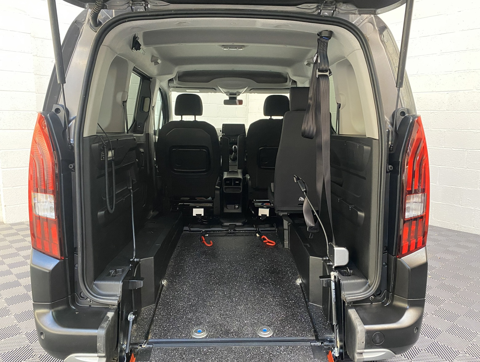 Peugeot Rifter WAV wheelchair accessible vehicle for sale at Michael Harraway Cars, Weston-super-Mare, with three passenger seats, space for one wheelchair user, and a lightweight fold-flat rear access ramp. SF20 GNP 10