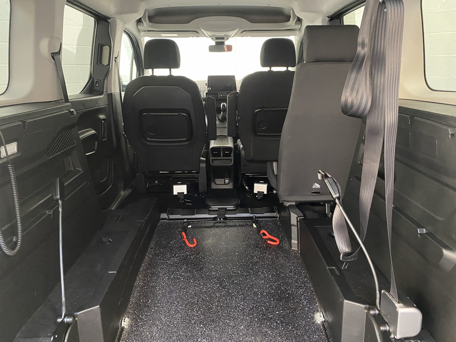 Peugeot Rifter WAV wheelchair accessible vehicle for sale at Michael Harraway Cars, Weston-super-Mare, with three passenger seats, space for one wheelchair user, and a lightweight fold-flat rear access ramp. SF20 GNP 11