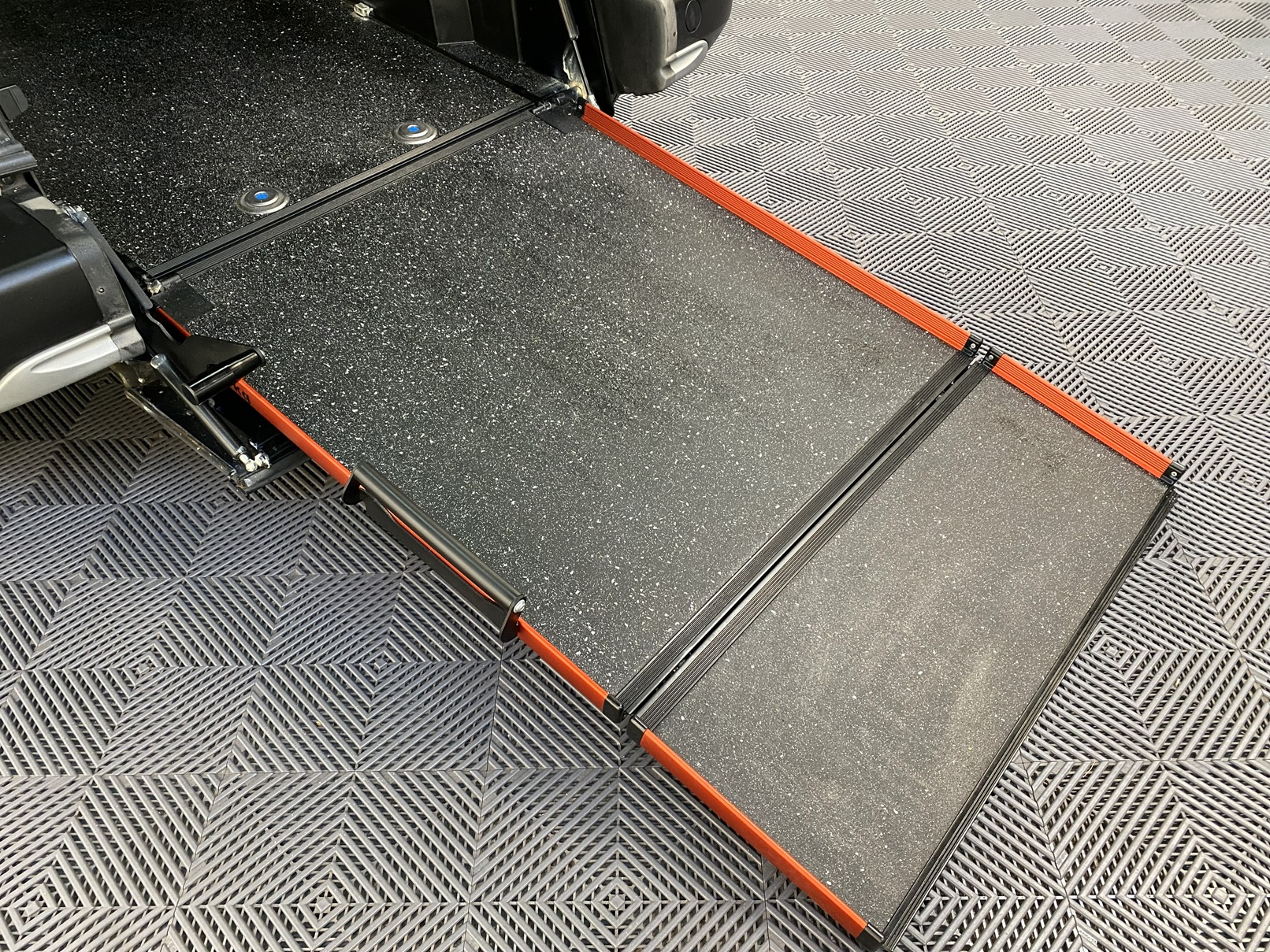 Peugeot Rifter WAV wheelchair accessible vehicle for sale at Michael Harraway Cars, Weston-super-Mare, with three passenger seats, space for one wheelchair user, and a lightweight fold-flat rear access ramp. SF20 GNP 12