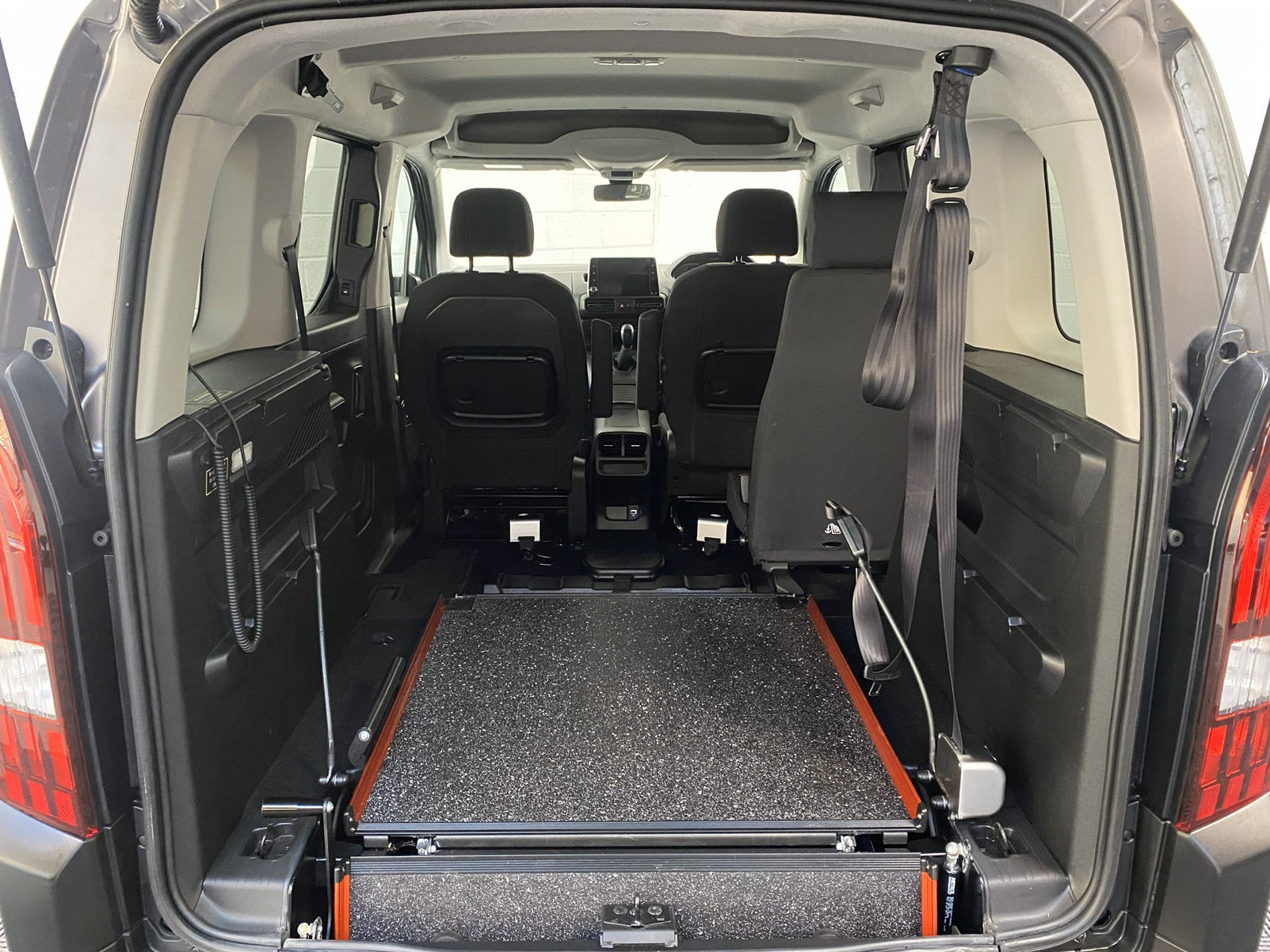 Peugeot Rifter WAV wheelchair accessible vehicle for sale at Michael Harraway Cars, Weston-super-Mare, with three passenger seats, space for one wheelchair user, and a lightweight fold-flat rear access ramp. SF20 GNP 14