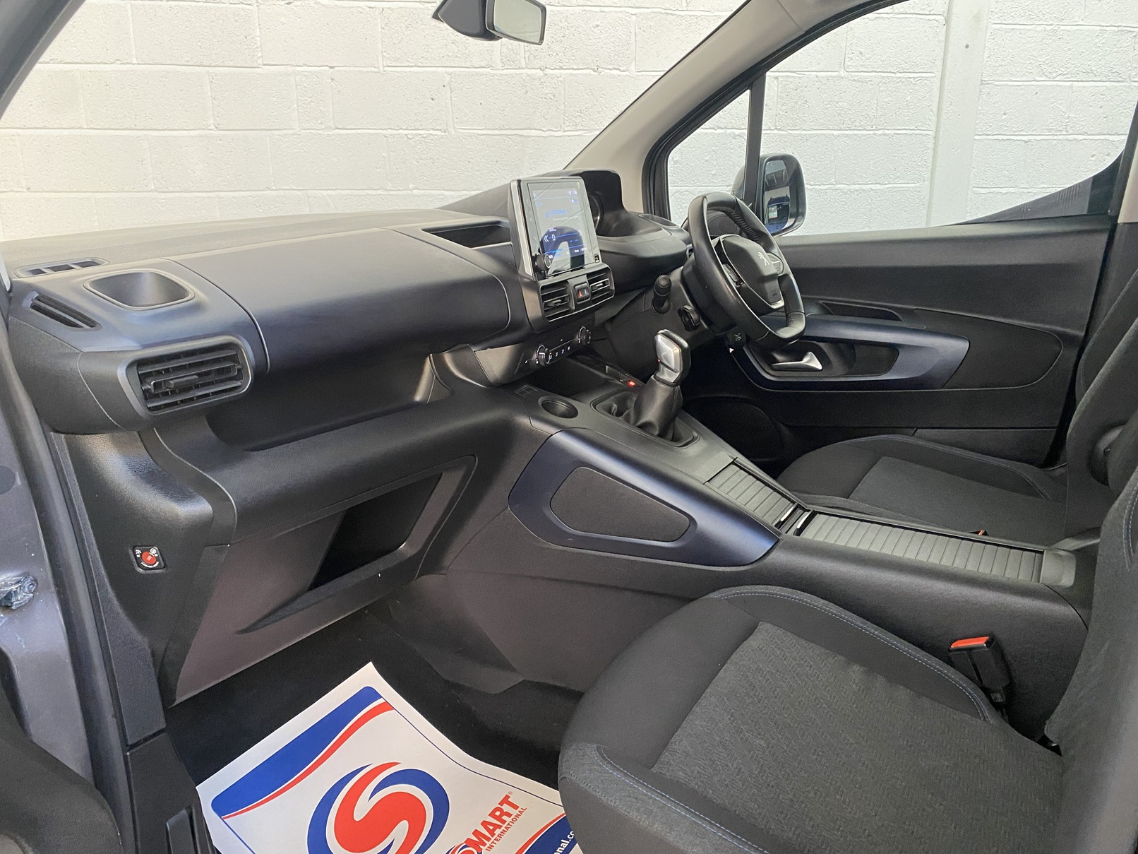 Peugeot Rifter WAV wheelchair accessible vehicle for sale at Michael Harraway Cars, Weston-super-Mare, with three passenger seats, space for one wheelchair user, and a lightweight fold-flat rear access ramp. SF20 GNP 15