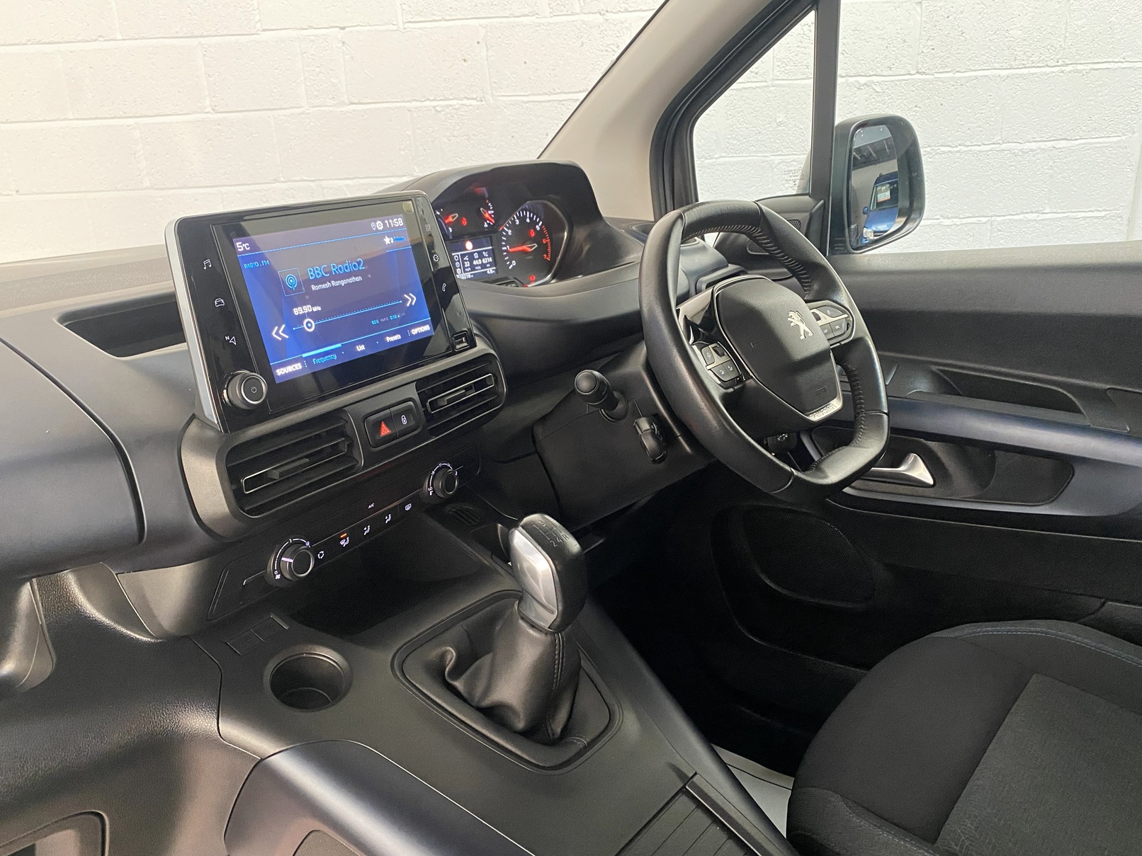 Peugeot Rifter WAV wheelchair accessible vehicle for sale at Michael Harraway Cars, Weston-super-Mare, with three passenger seats, space for one wheelchair user, and a lightweight fold-flat rear access ramp. SF20 GNP 16