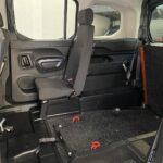 Peugeot Rifter WAV wheelchair accessible vehicle for sale at Michael Harraway Cars, Weston-super-Mare, with three passenger seats, space for one wheelchair user, and a lightweight fold-flat rear access ramp. SF20 GNP 20