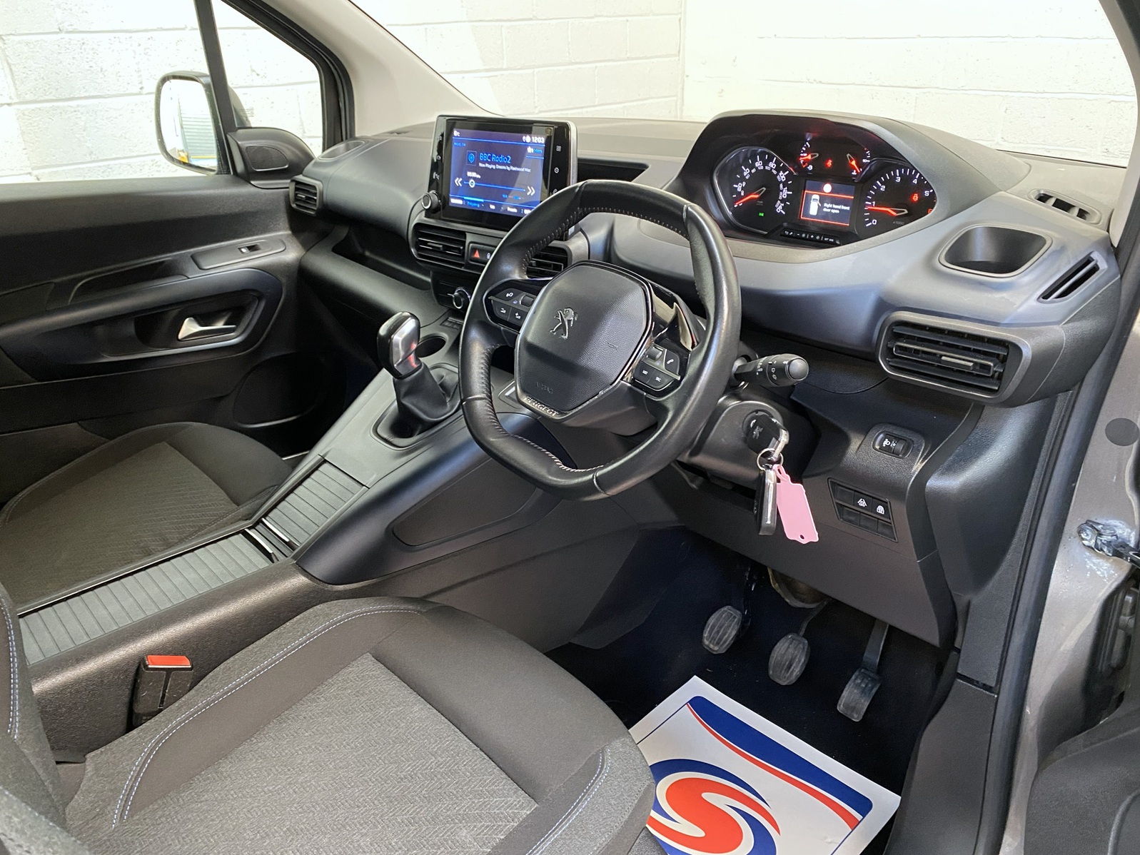 Peugeot Rifter WAV wheelchair accessible vehicle for sale at Michael Harraway Cars, Weston-super-Mare, with three passenger seats, space for one wheelchair user, and a lightweight fold-flat rear access ramp. SF20 GNP 22