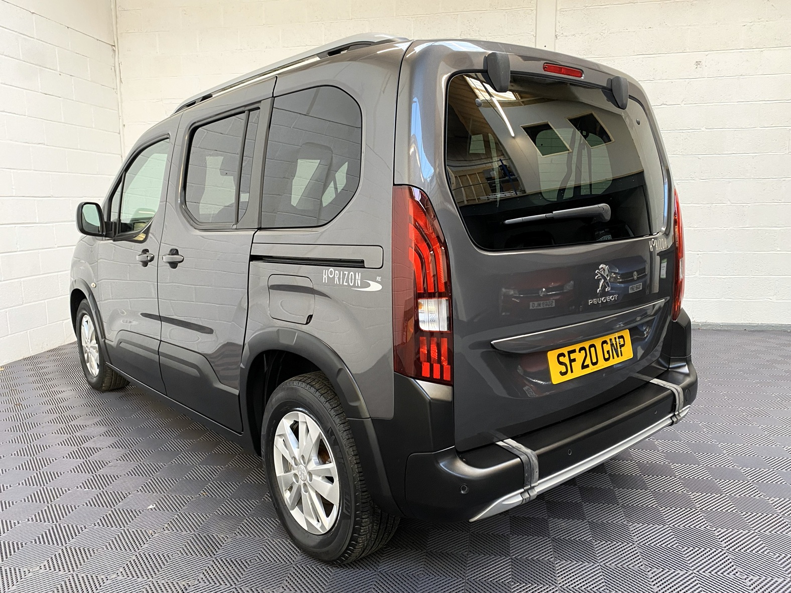 Peugeot Rifter WAV wheelchair accessible vehicle for sale at Michael Harraway Cars, Weston-super-Mare, with three passenger seats, space for one wheelchair user, and a lightweight fold-flat rear access ramp. SF20 GNP 5