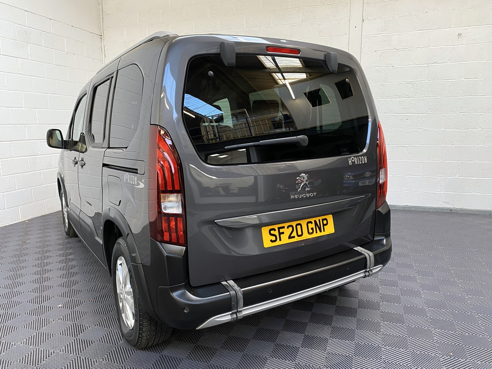 Peugeot Rifter WAV wheelchair accessible vehicle for sale at Michael Harraway Cars, Weston-super-Mare, with three passenger seats, space for one wheelchair user, and a lightweight fold-flat rear access ramp. SF20 GNP 6