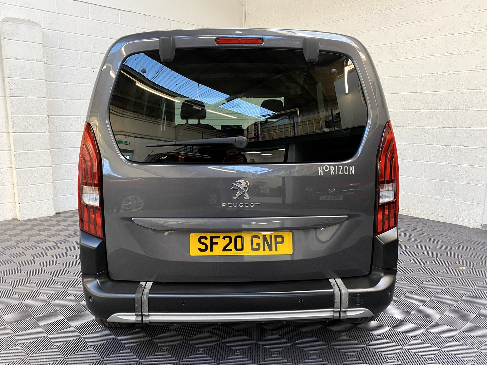 Peugeot Rifter WAV wheelchair accessible vehicle for sale at Michael Harraway Cars, Weston-super-Mare, with three passenger seats, space for one wheelchair user, and a lightweight fold-flat rear access ramp. SF20 GNP 7