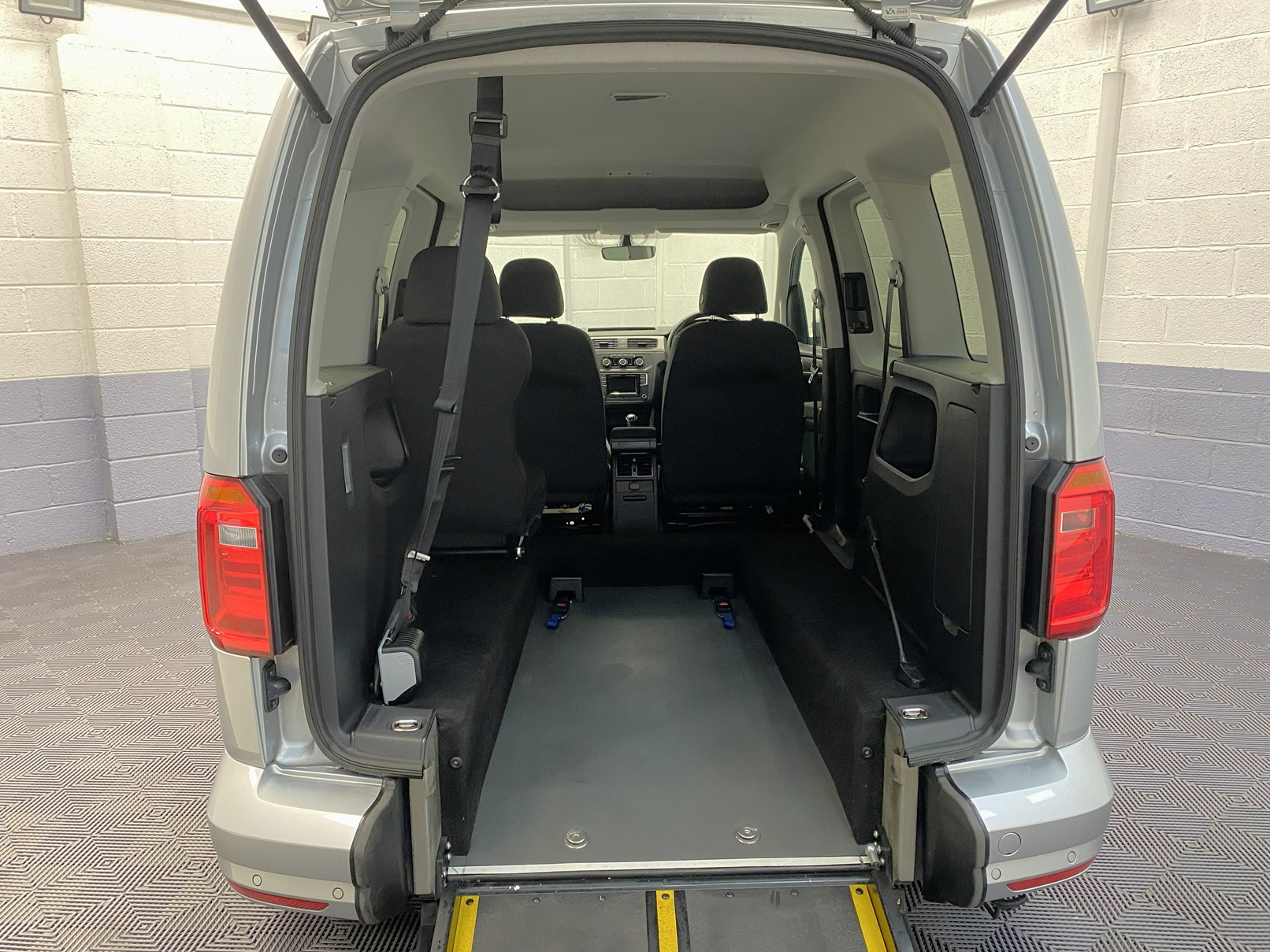 A silver Volkswagen Caddy Life wheelchair accessible vehicle WAV that is for sale at Michael Harraway Cars in Weston super Mare. HJ20 AXZ 12