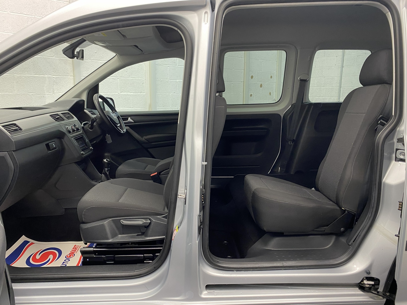 A silver Volkswagen Caddy Life wheelchair accessible vehicle WAV that is for sale at Michael Harraway Cars in Weston super Mare. HJ20 AXZ 18