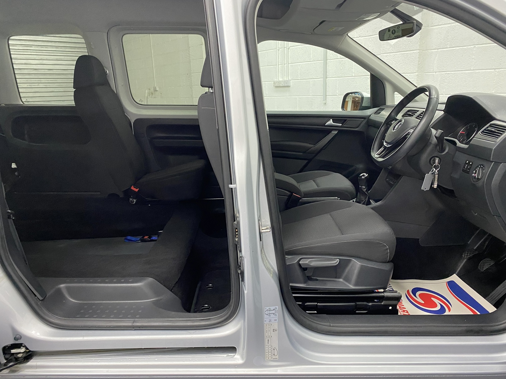 A silver Volkswagen Caddy Life wheelchair accessible vehicle WAV that is for sale at Michael Harraway Cars in Weston super Mare. HJ20 AXZ 22