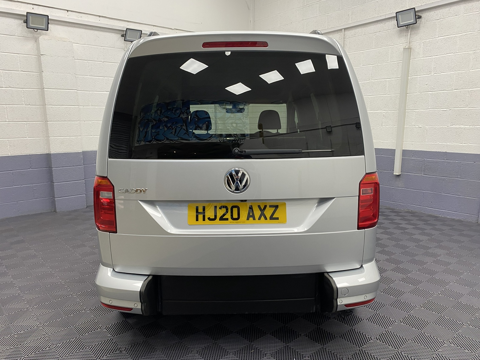 A silver Volkswagen Caddy Life wheelchair accessible vehicle WAV that is for sale at Michael Harraway Cars in Weston super Mare. HJ20 AXZ 7