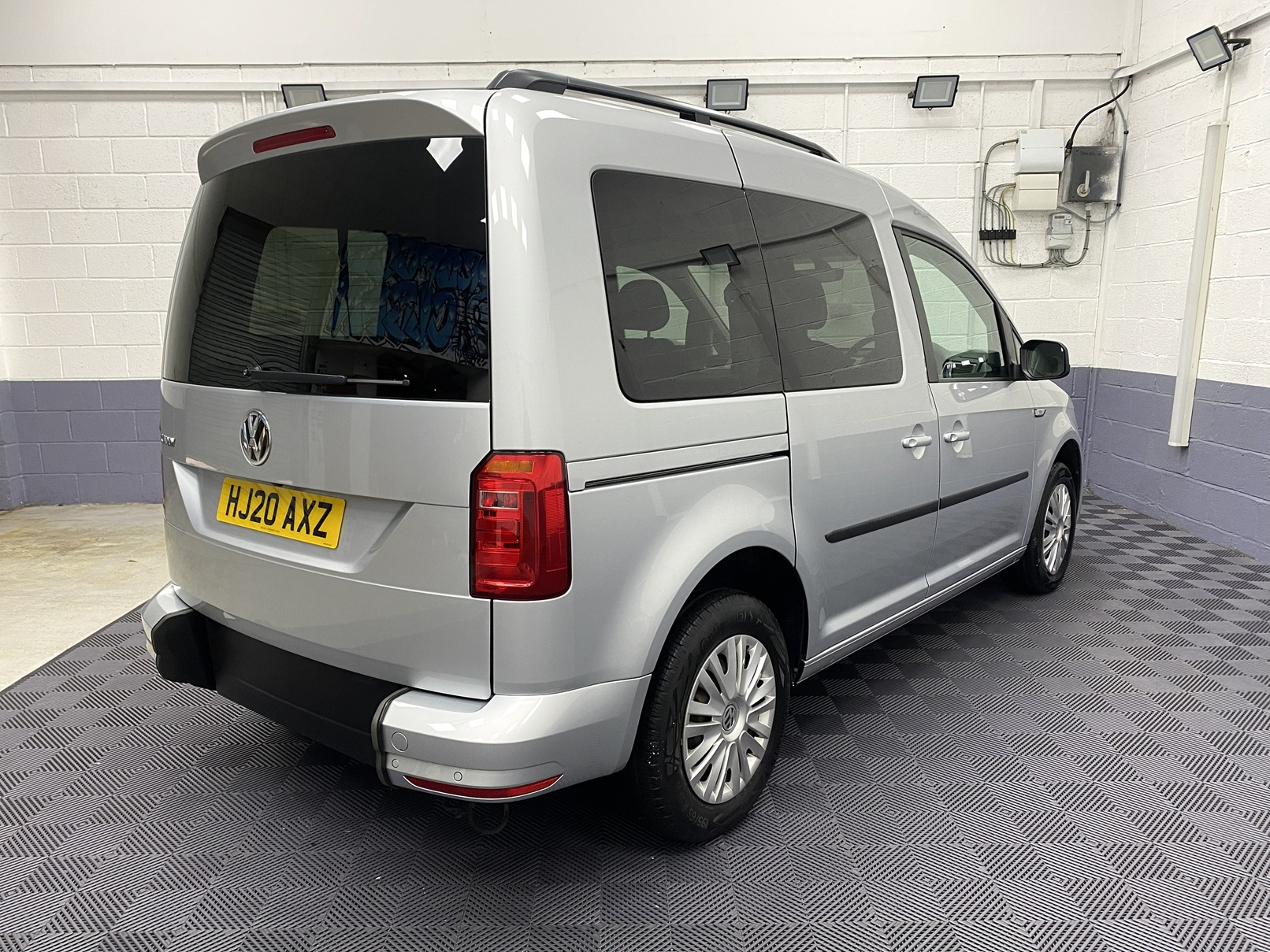 A silver Volkswagen Caddy Life wheelchair accessible vehicle WAV that is for sale at Michael Harraway Cars in Weston super Mare. HJ20 AXZ 8